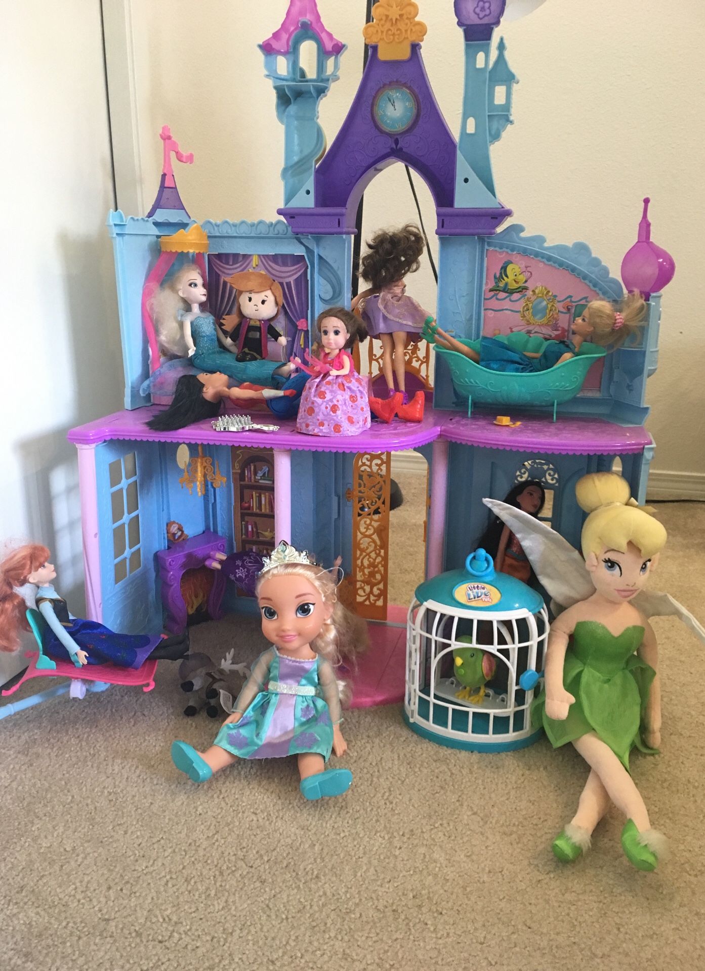 Princess doll house with dolls, parrot, other some toys and 2 board games and one puzzle $10