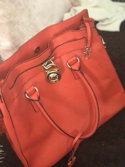Michael Kors , woman’s Hamilton large north/south tote red.