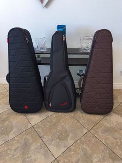 Guitar case's  2 Roadrunner  1 Fender.