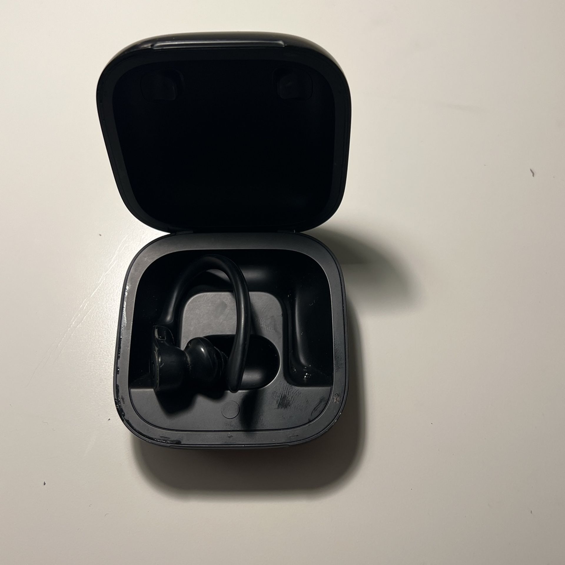 One Powerbeat Earbud With Charging Case