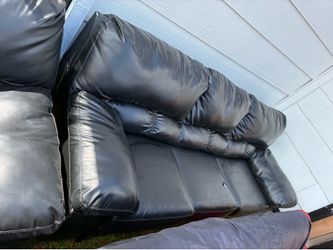 Black leather sofa and loveseat