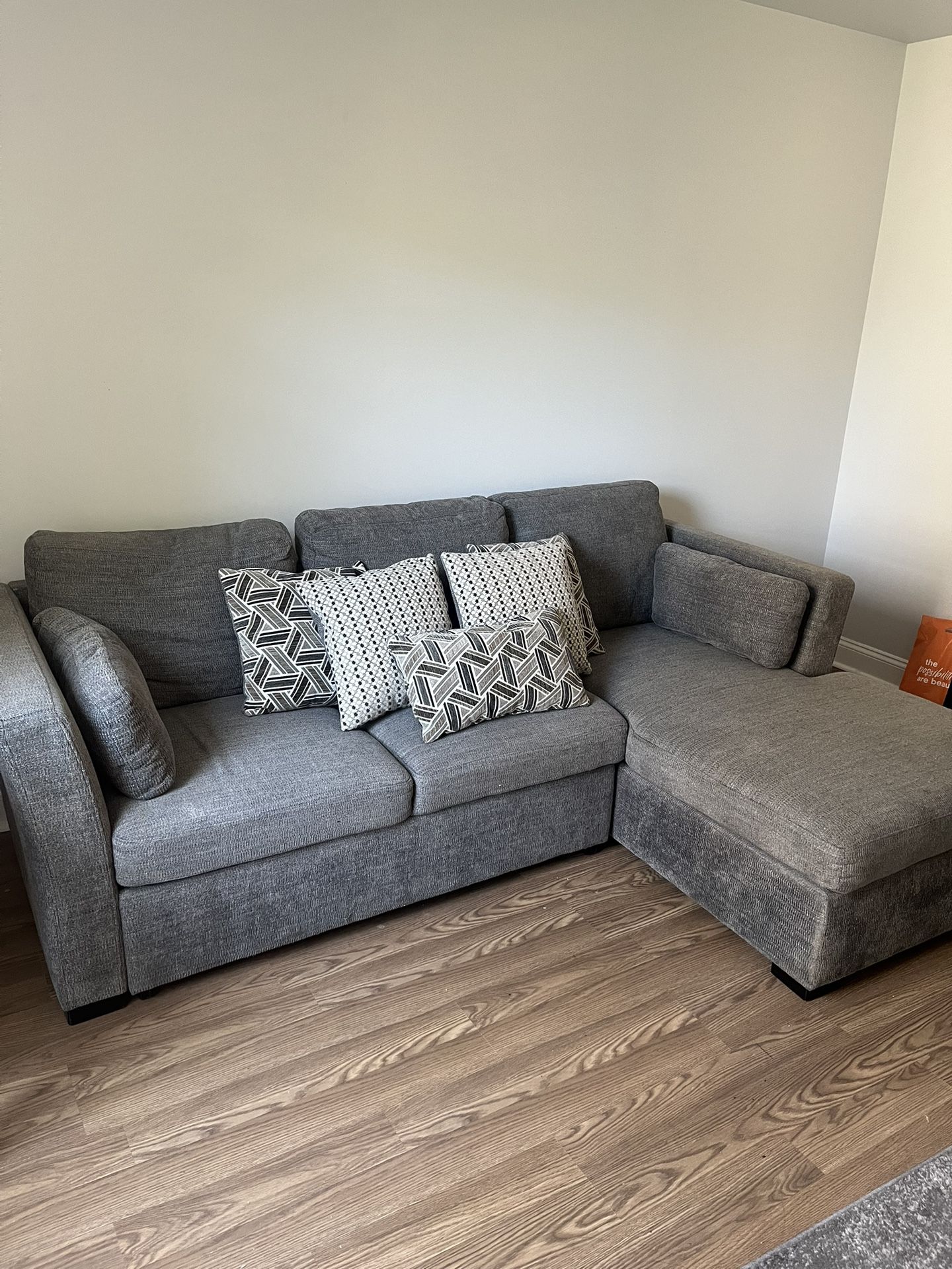 BARELY USED PULL OUT COUCH WITH STORSGE