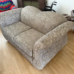 two-seater sofa, also commonly referred to as a loveseat or couch