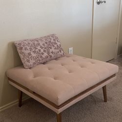 Velvet ottoman and small throw pillow