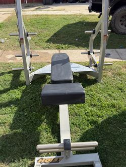 Very nice and strong Olympic weight bench can adjust bench to many positions. Can put weight plates on rack as well. $400