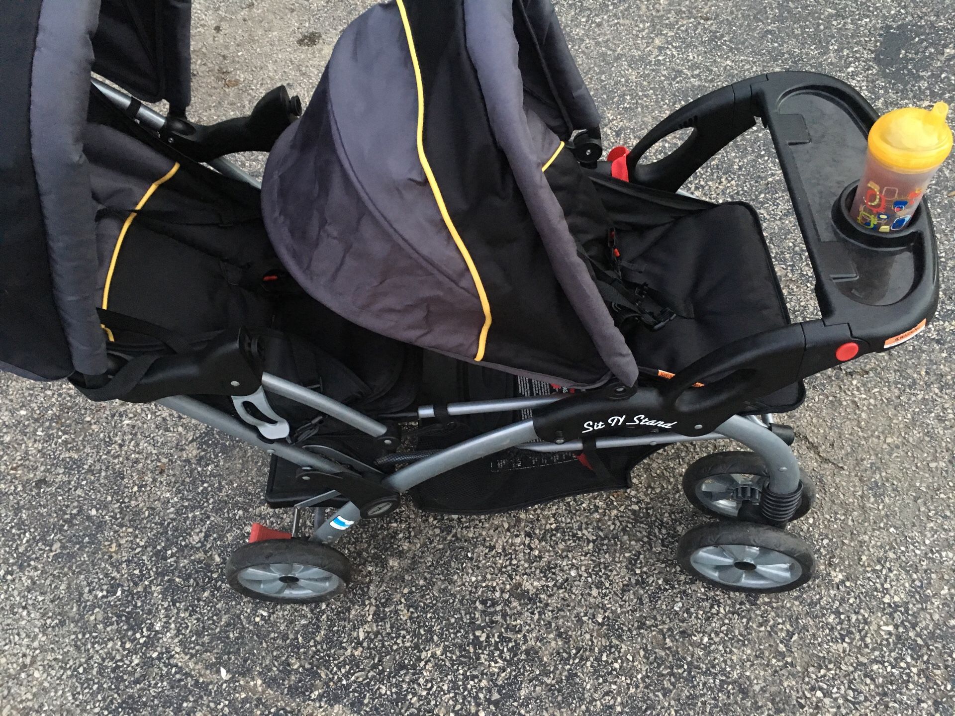 Baby trend sit n stand double stroller. Black/yellow/gray. Missing tray in second seat.