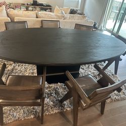 RH dinning Wood/Blackened Steel oval table with 6 Wood/Italian Leather chairs 