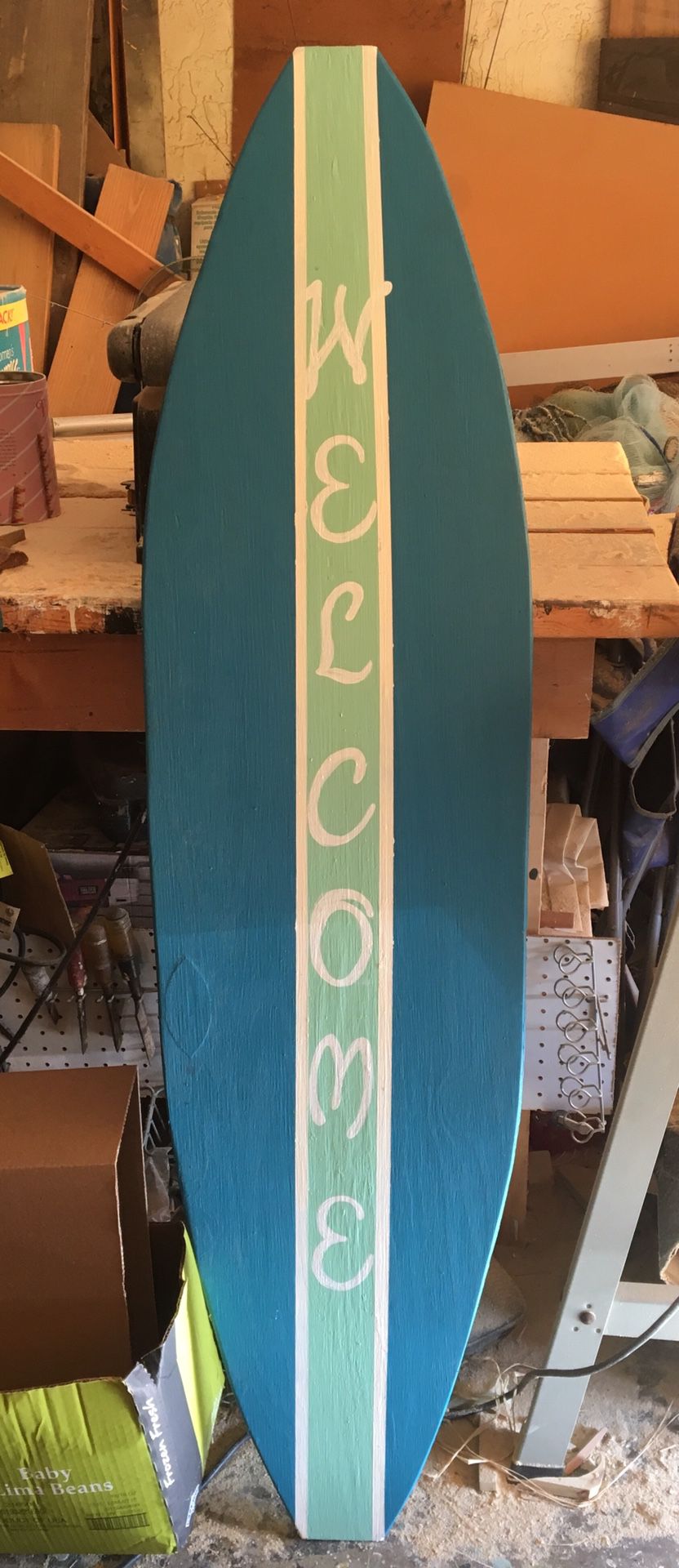 Solid wood welcome surfboard