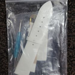 white genuine leather watch strap and a watch repair tool kit.