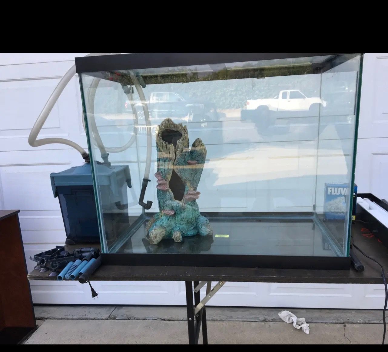 57 Gallon Fish Tank, Stand, And Assorted Items.