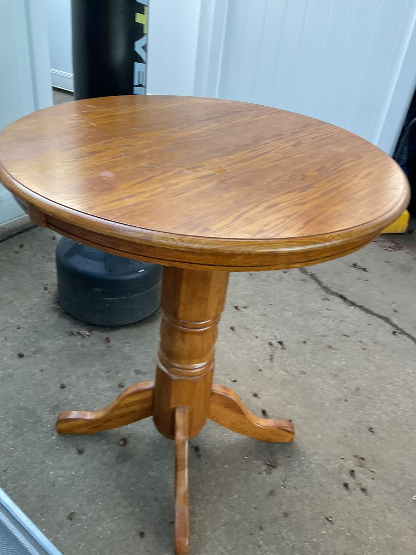 A Very Good, Wooden High Table, 41” Tall, And 34” Diameter In Very Good Conditions, Keeps Apart For Better Transportation