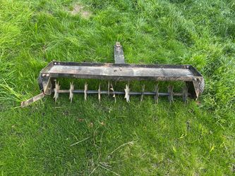 Agri-Fab tow behind spike aerator