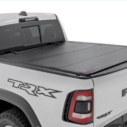 Rough Country Hard Tri-Fold Flip Up Truck Bed Tonneau Cover For Dodge Ram 1500 (2019-2025) TRX (2021-2025) - Flush Aluminum Bed Cover, Fits 5'7" (66.7