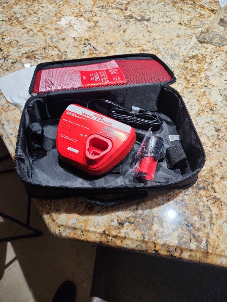 Milwaukee Battery 2ah And Charger With Contractors Bag