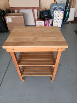 Solid wood table with wheels