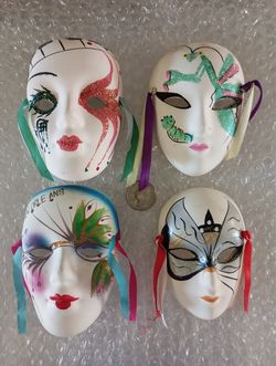 Collection of 9 porcelain masks; 3”x4” wall hangings