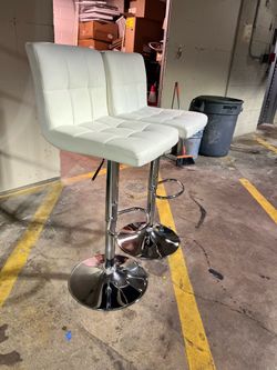 2 white bar stools