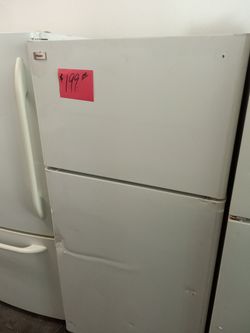 Refrigerator white has a dent front door , perfect for garage . Warranty . Delivery available . 2203 Fowler st. Ft . Myers 33901
