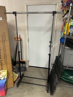 Free Clothing rack on wheels with adjustable rod