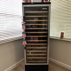 Vinotemp Dual zone wine fridge 160 bottle & wine Barrel table with 3 stools  (will throw in all contents of est value of contents $3500to $4000) 