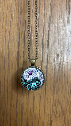 Blue and purple yin Yang necklace on bronze chain with lobster claw clasp
