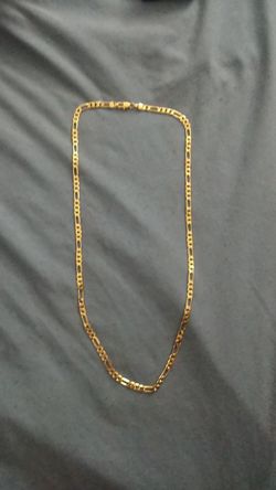 Gold plated, not real gold, chain 24 inch long very nice