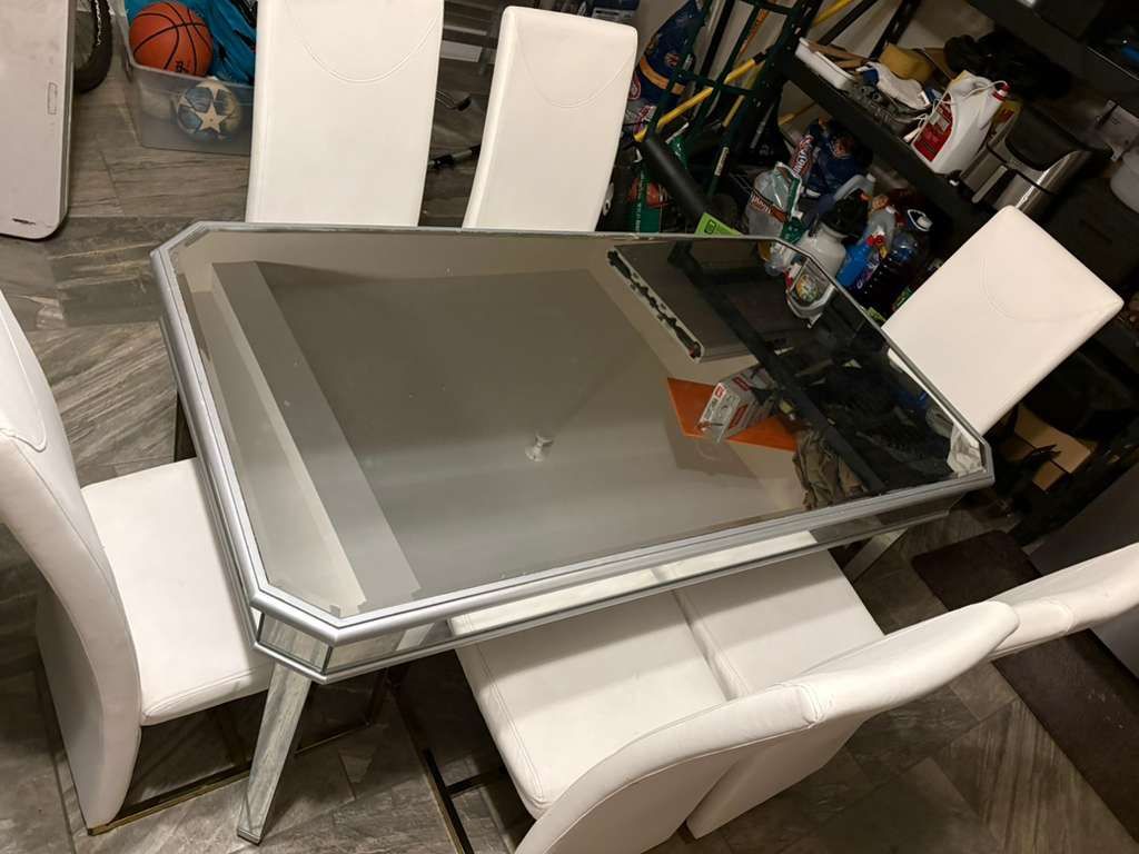 Dinning table and 6 chairs in a fair condition