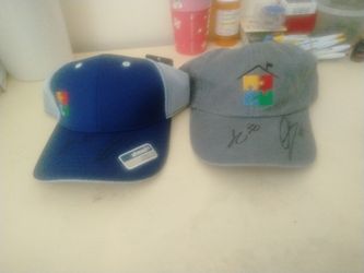 Two autism baseball caps signed by jihad Campbell and macuba of the Philadelphia eagles