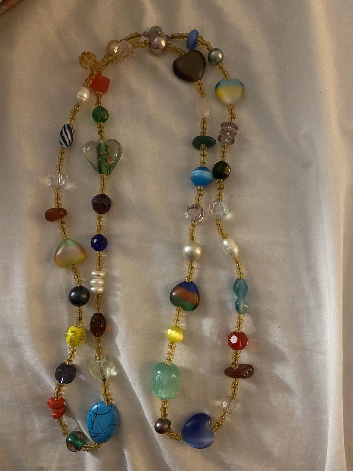 Multiple beaded necklace.