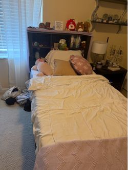 Twin size bed with bookshelf , two drawers and opening on other size for additional storage . Minor scratches . (Will include njghtstand that will nee