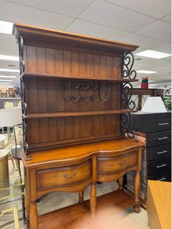 Gorgeous baker's rack features a rich wood hutch with a built-in wrought iron wine rack and glass hanger -60” x 18” x 90” - excellent condition