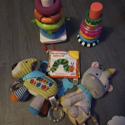 Baby toys
Skip hop toys, stacking toys and  very hungry caterpillar crinkle book