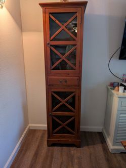Wooden cabinet with glass doors
