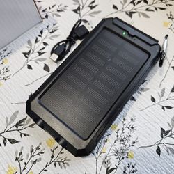 New, never used compact solar powered, rechargeable 20000 power Bank with compass and light. 