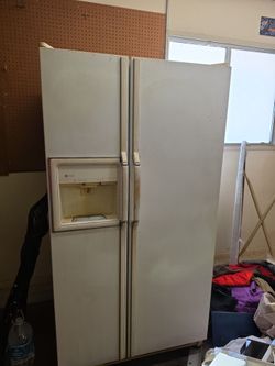 White side by side refrigerator.