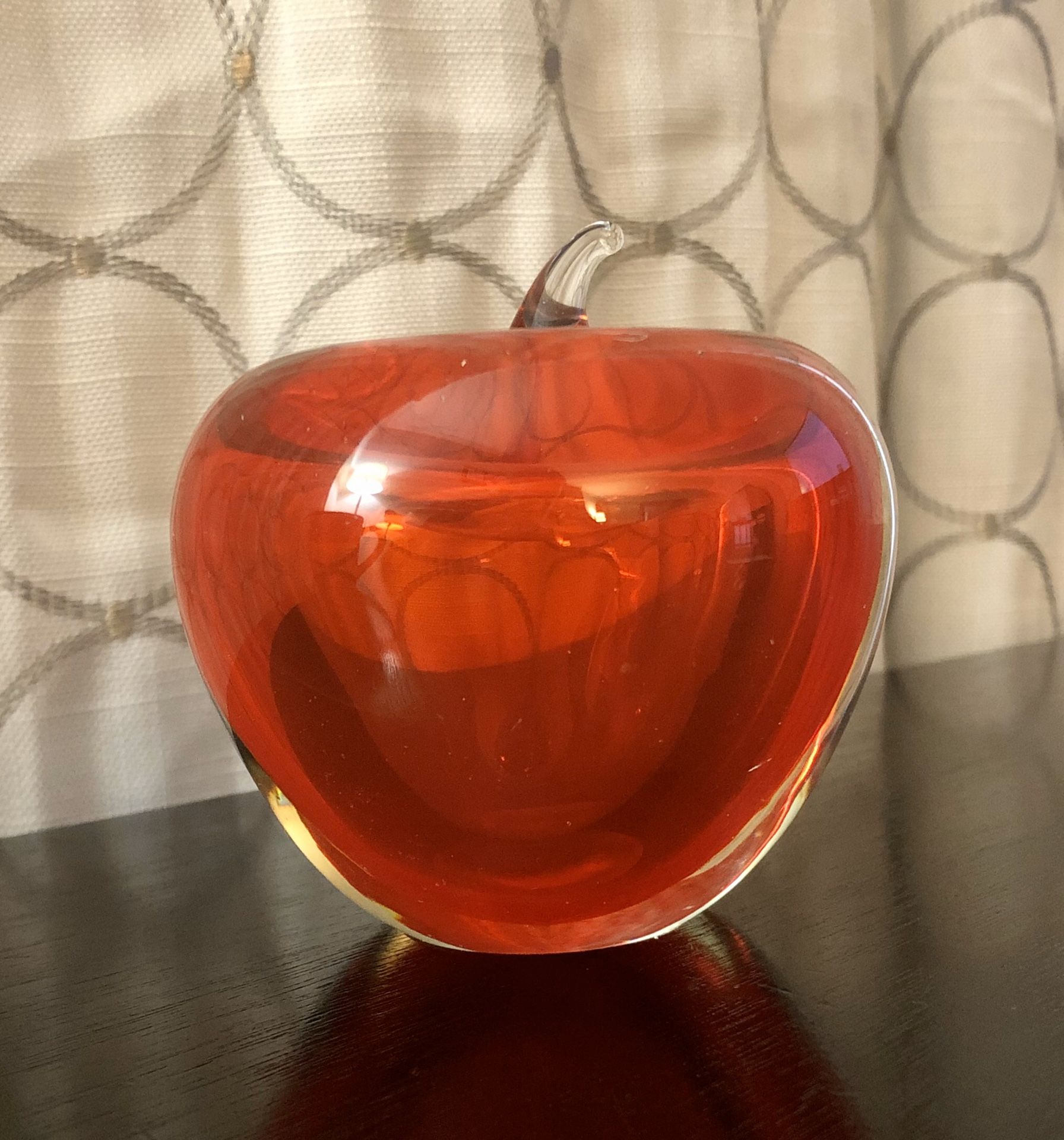 Paperweight collectibles of a glass, red Apple.