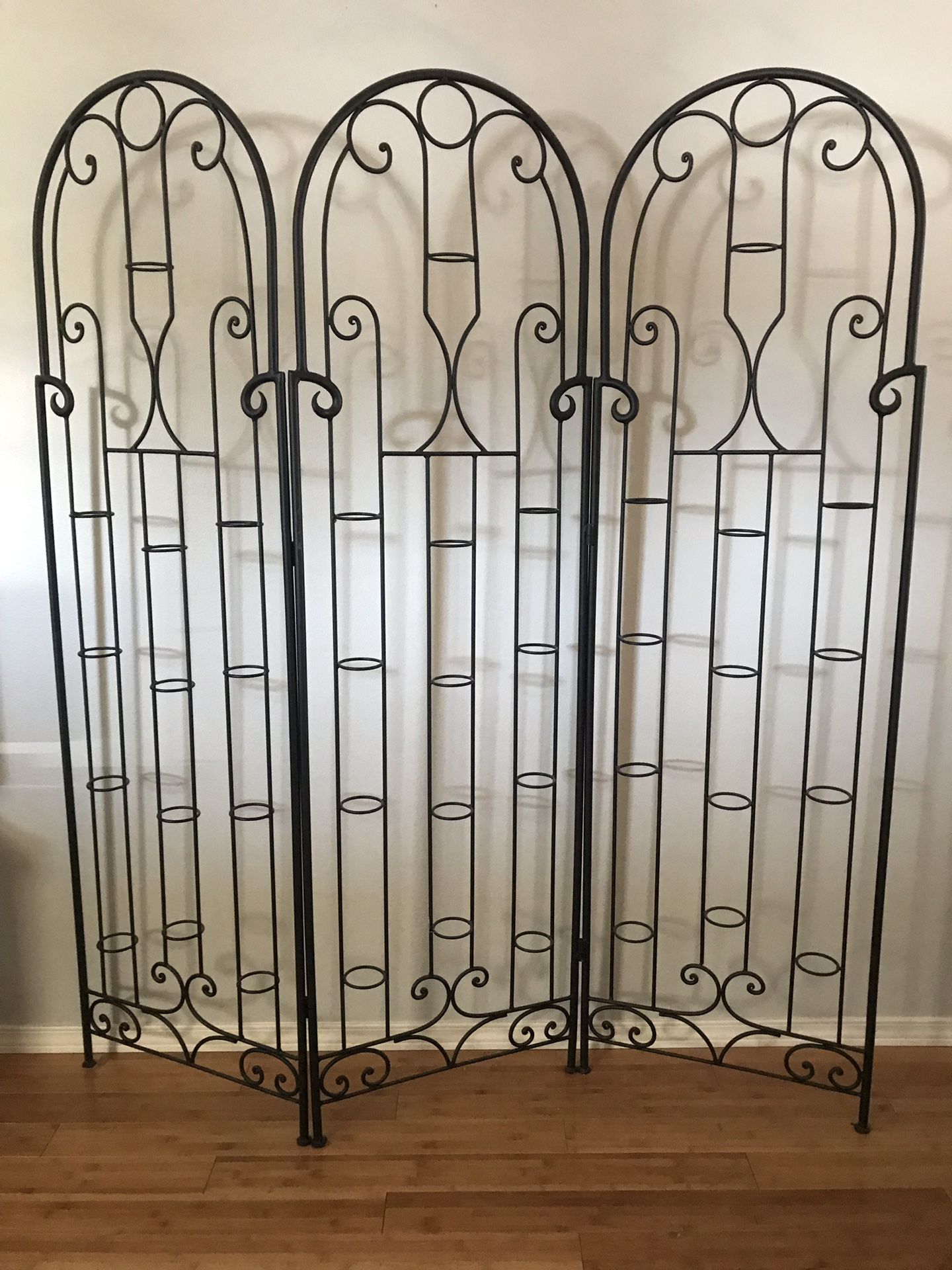 Illuminations black iron room divider/ votive holder with room for 39 candles for Sale in