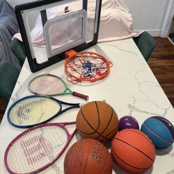 Sports kit with tennis rackets, basketball hoop, and balls