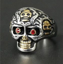 Gold and silver stainless steel skull ring with red cz eyes