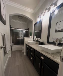 2 black framed mirrors