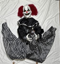 Spooky oversized hanging clown decoration from Jack O’ Lantern Lane, measuring approximately 67 inches long.