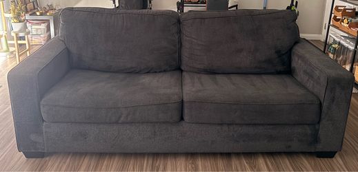 Sofa and matching Ottoman from Ashley