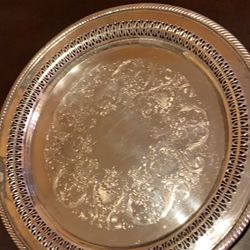 Wm Rogers 170 silver plate 12.5” round platte. Engraved pattern with roped edge.