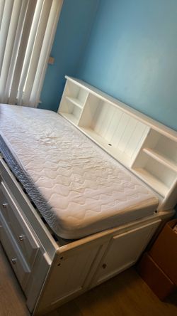 Twin day bed with attachment drawers and under bed storage.