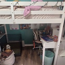 2 white loft beds with desks