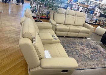 Beige leather fully reclining couch and love seat