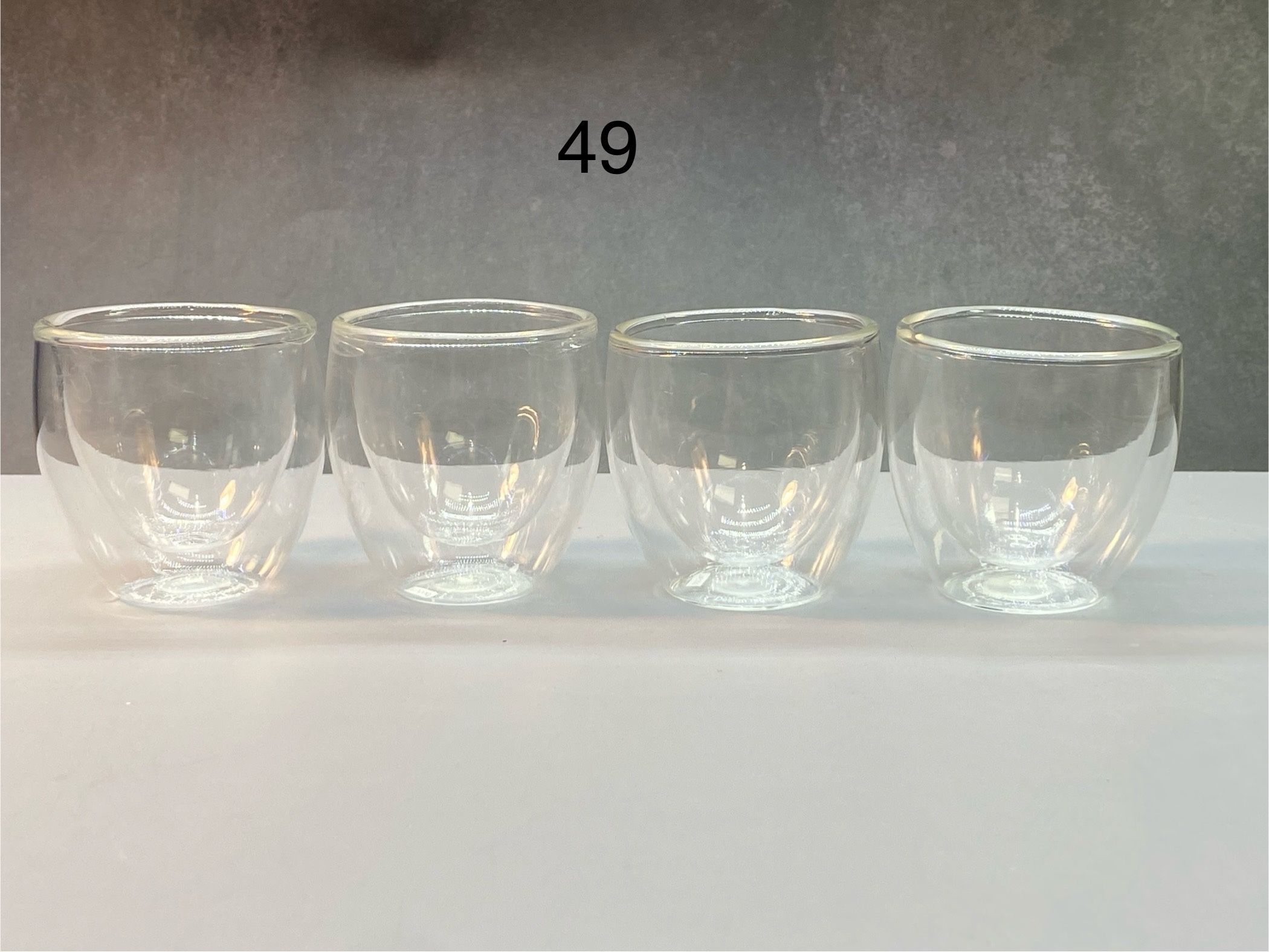 Set of (4) Beautiful Bodum glass cups ideal for hot tea, sake, vodka, shots or other hot drinks or liquors. They make aesthetic contemporary minimalis