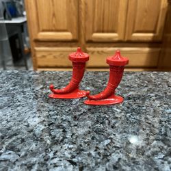 Plastic Viking Red horn salt and pepper shakers Have been on display in a cabinet with a very large salt and pepper shakers collection.  Preowned good