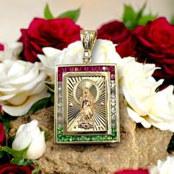 14kt 17.60g Tri Color Gold with Princess Cut Red/Green/Clear Stones Religious Pendant.