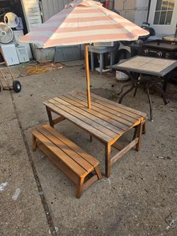 Price is firm.. solid wood cedar children's picnic table with umbrella